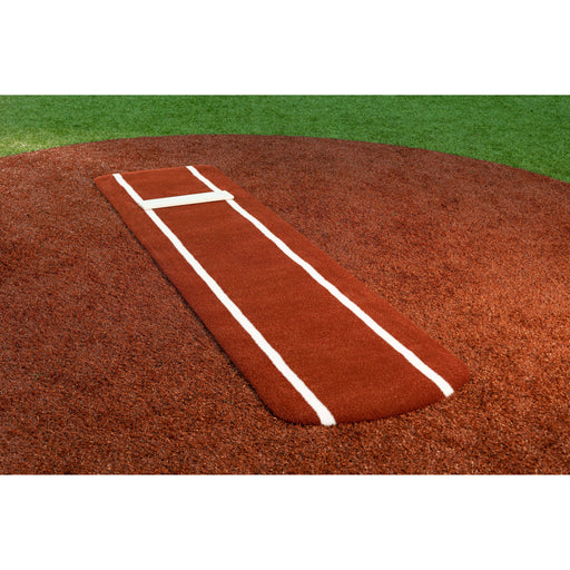 Portolite Ultimate Spiked Practice Mat in red clay on a softball pitching mound
