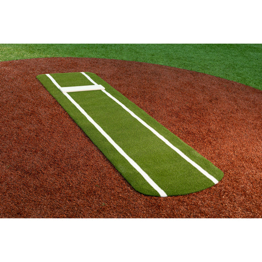 Portolite Signature Practice Mat with spikes in green on a softball pitching mound